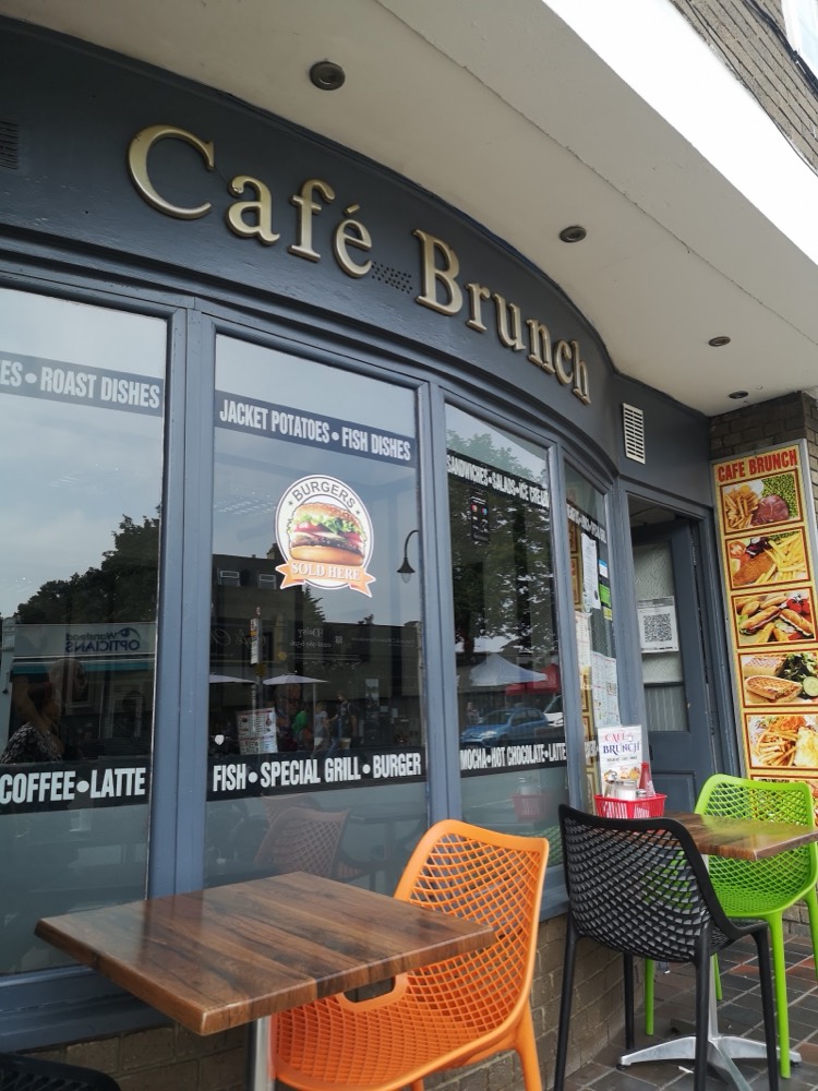 The gold ‘Café Brunch’ lettering on the slate-grey shopfront, with pavement tables on Wanstead High Street